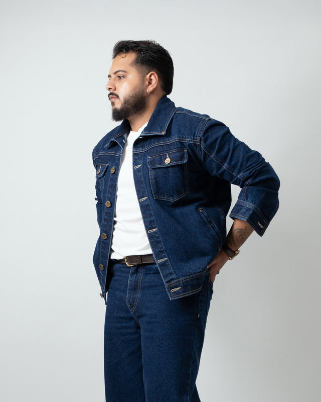 Man wearing a denim jacket and jeans on a white background